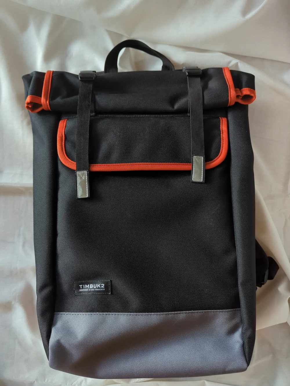Timbuk2 Black Backpack with Orange Trim and Gray Base